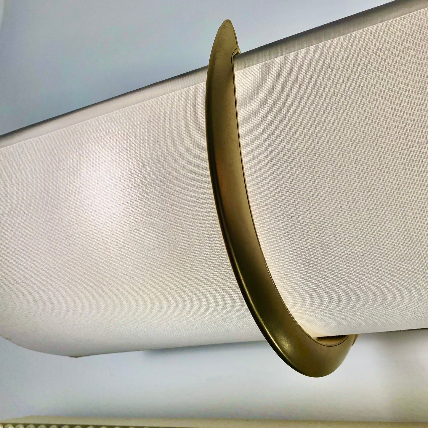 Smooth white EzLightWraps shade with a matte gold finish bracket