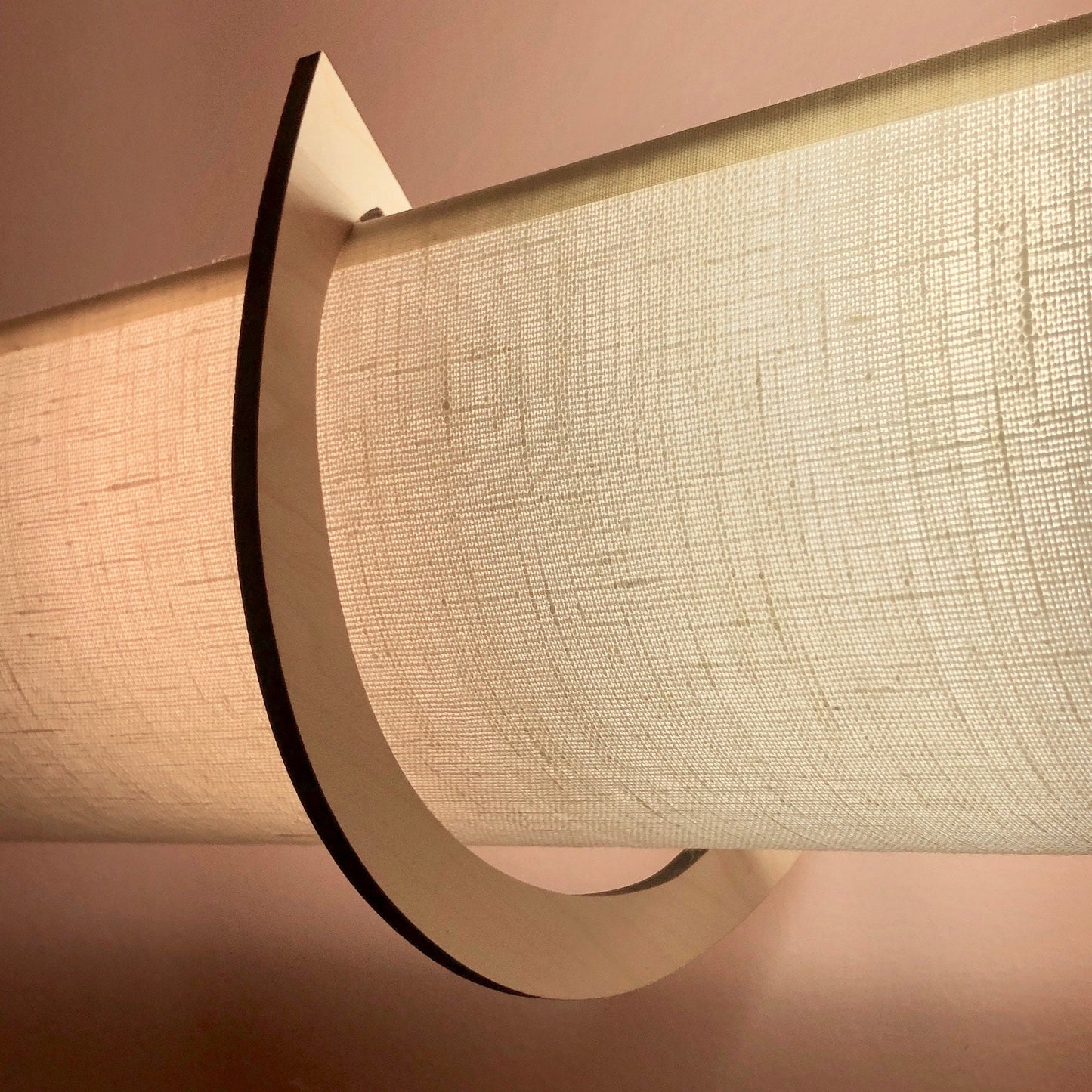 This is a description of the linen shade showing texture upclose and benefits of EzLightWraps - easy to install, handmade and lightweight. Each shade comes with their own brackets.