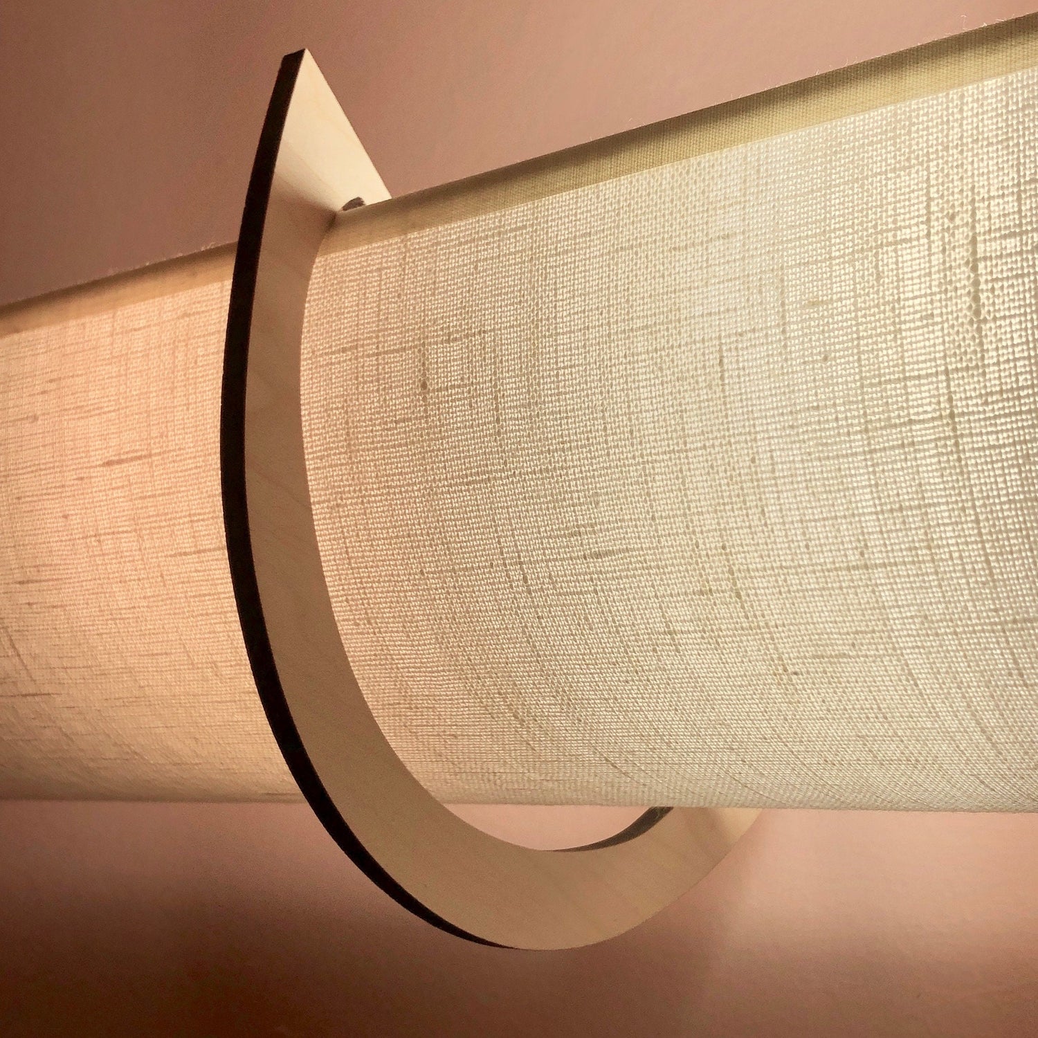 This is a description of the linen shade showing texture upclose and benefits of EzLightWraps - easy to install, handmade and lightweight. Each shade comes with their own brackets.